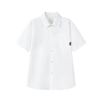 Boy wearing a white casual short-sleeve summer shirt with a front pocket, button-up style, from Everanne.