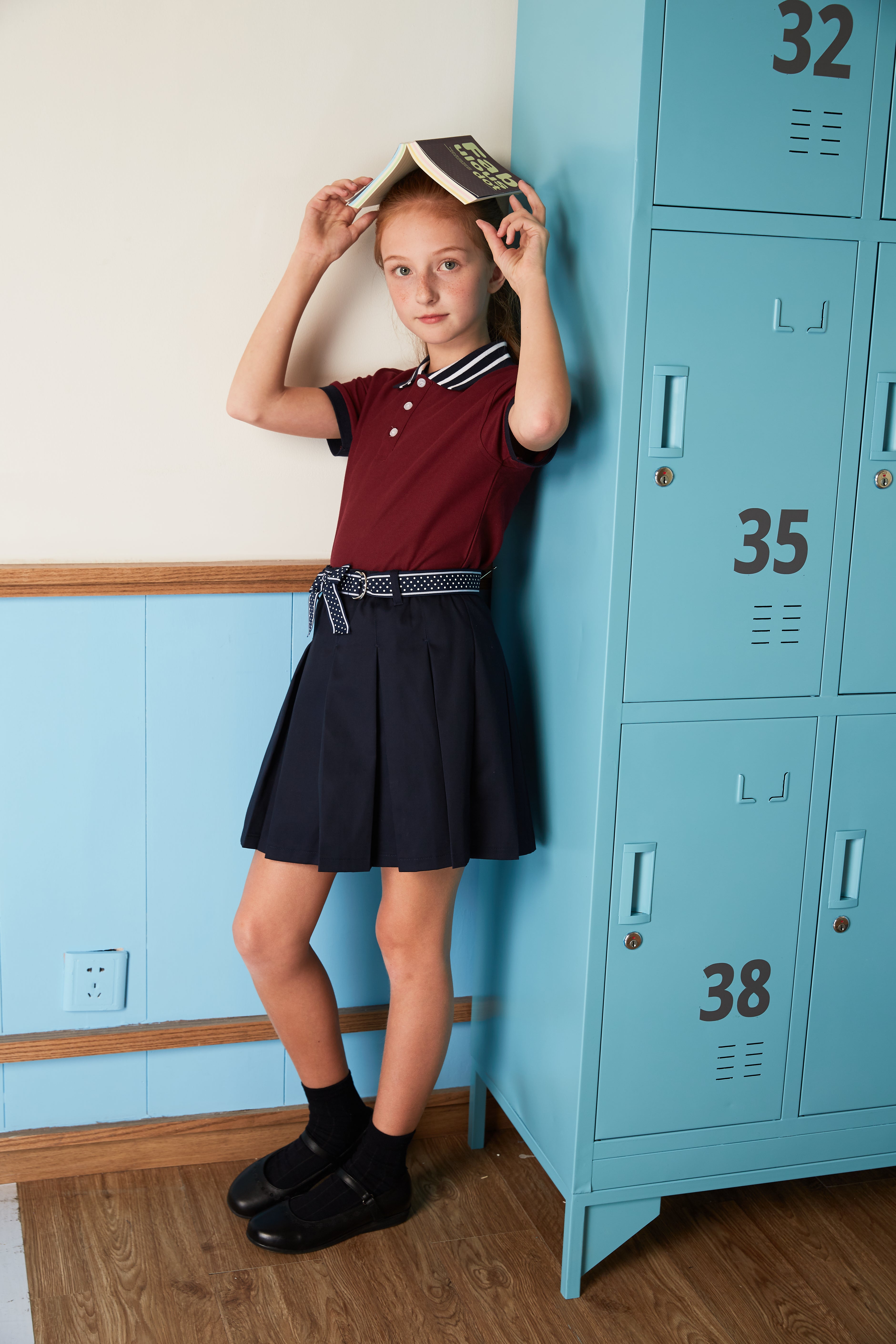 Everanne girls' navy mini skirt with bow tie belt, lightweight twill fabric, suitable for school or casual wear.