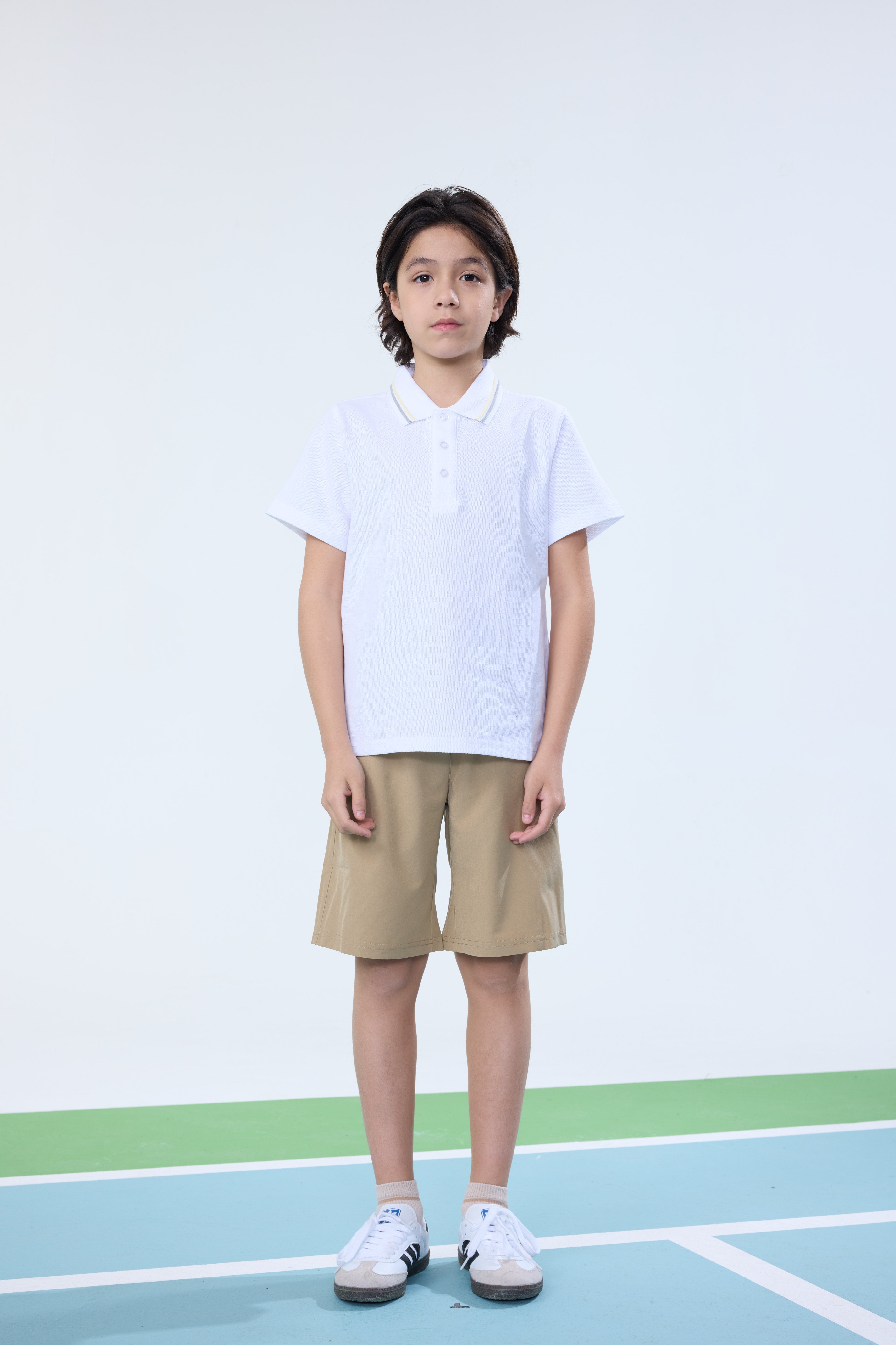 Everanne unisex kids short sleeve polo shirt in white with pique mesh cotton blend fabric, casual and comfortable for children.