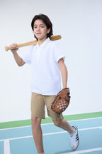 White unisex kids polo shirt by Everanne with short sleeves and cotton blend piqué mesh fabric, casual and comfortable.