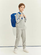 Everanne youth sports zip-up jacket with stand collar and contrast stripe details in grey, made of lightweight athletic fabric.