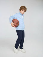 Everanne unisex youth sports zip-up jacket with stand collar and ribbing in blue, featuring a casual athletic style.