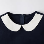 Everanne girls' blue pique short sleeve dress with V-neck, Peter Pan collar, and bow, perfect for casual occasions.