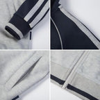 Everanne youth sports zip-up jacket with stand collar in navy and light gray colorblock stripes, designed for active wear.