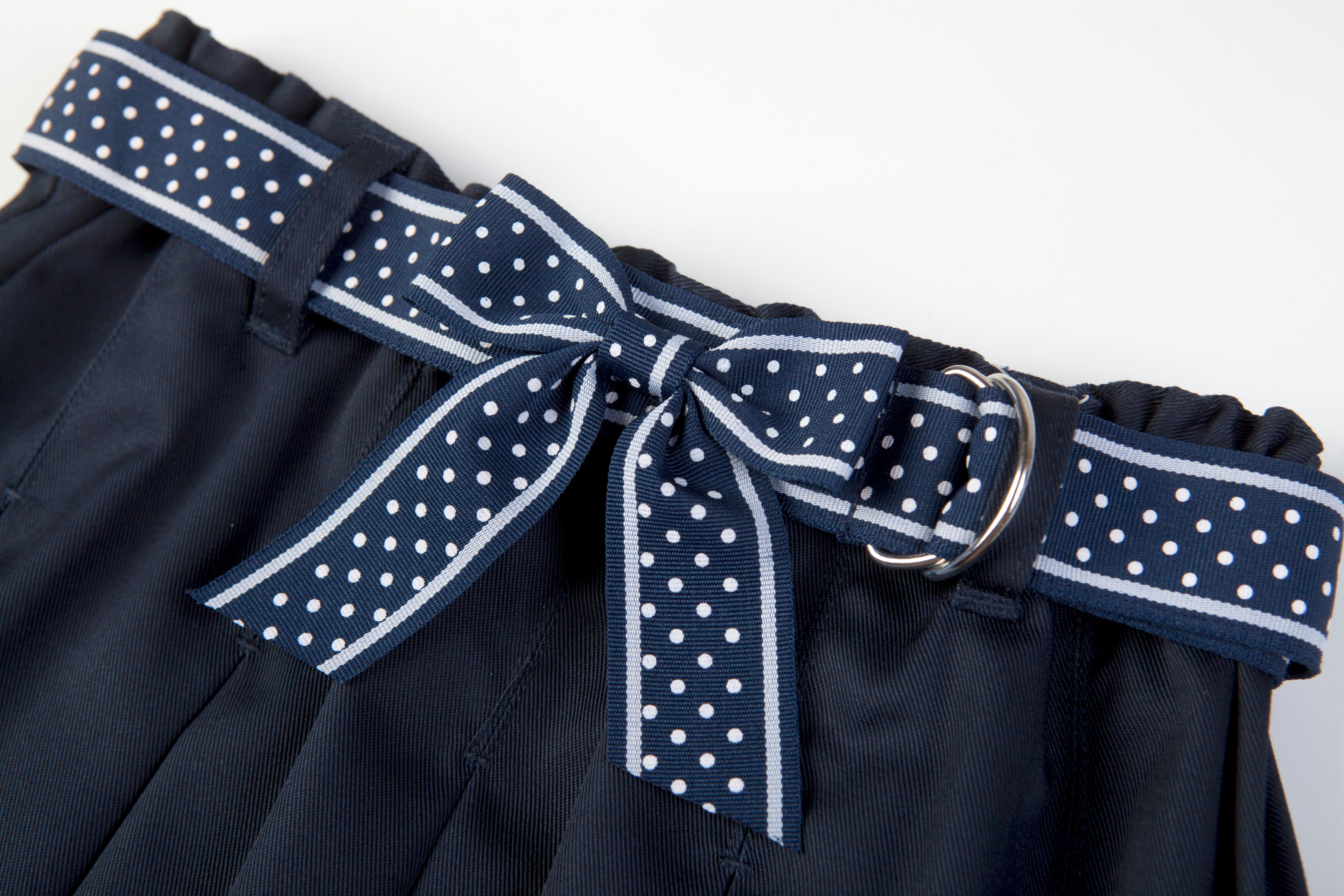 Everanne girls' navy mini skirt with bow tie belt, lightweight twill fabric, suitable for school and casual wear.