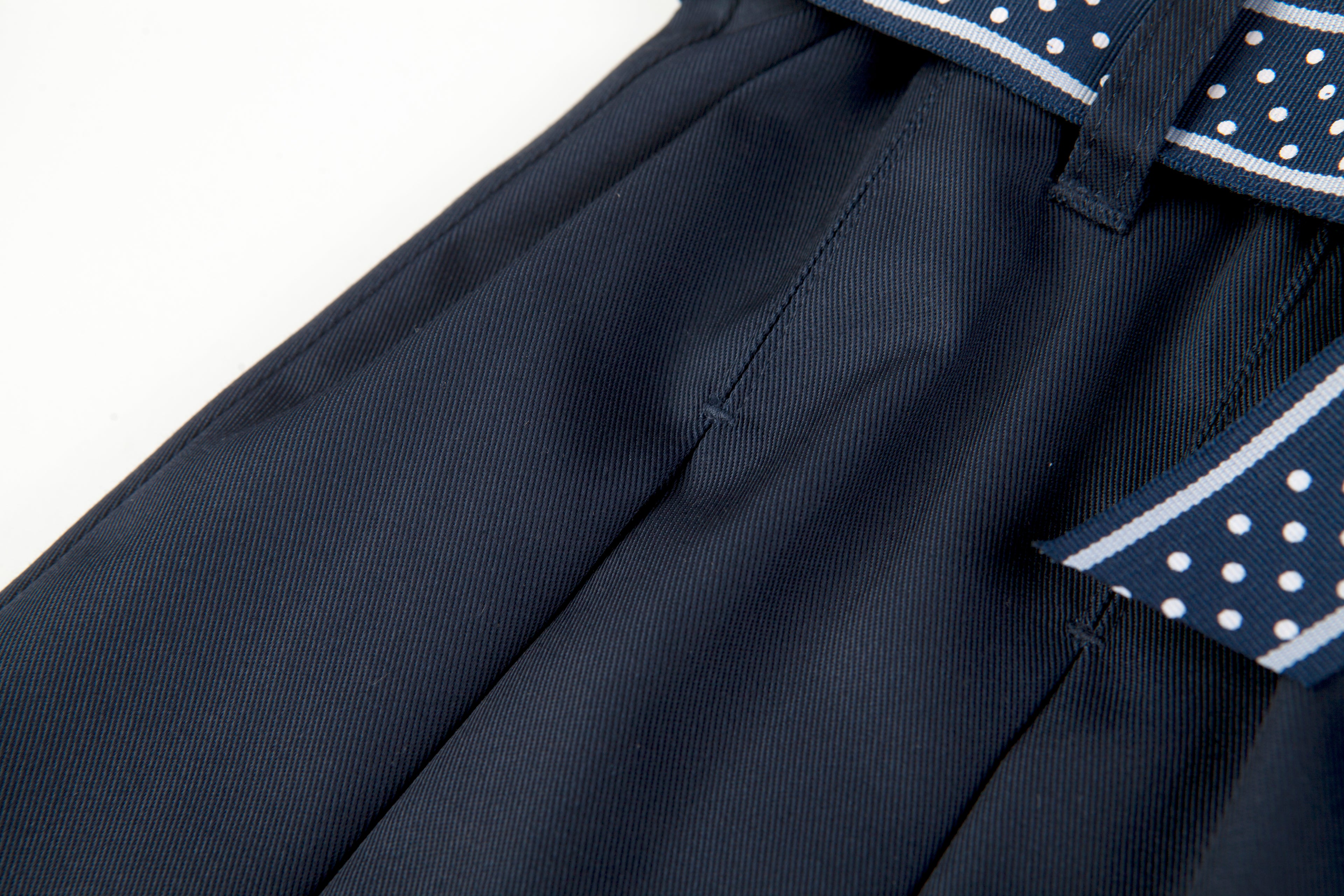 Everanne girls' navy mini skirt with bow tie belt, lightweight twill fabric, perfect for school or casual wear.