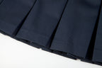 Everanne girls' navy mini skirt with bow tie belt, lightweight twill fabric, perfect for school or casual wear.