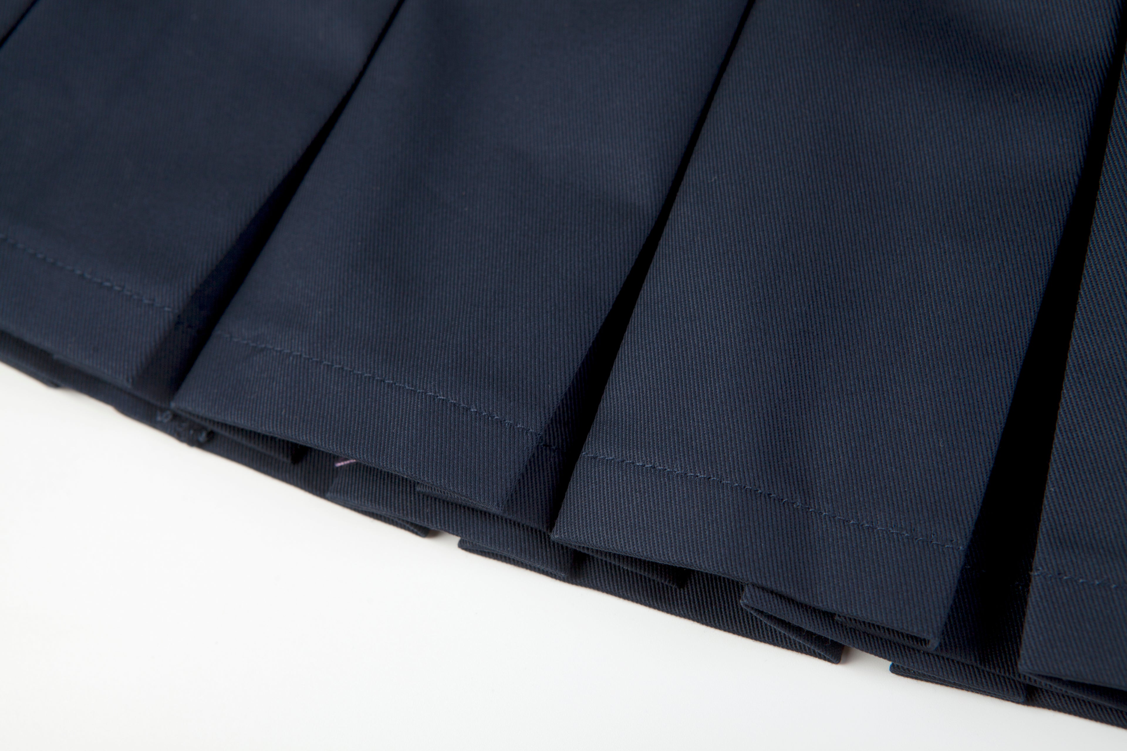 Everanne girls' navy mini skirt with bow tie belt, lightweight twill fabric, perfect for school or casual wear.