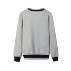 Back view of unisex black V-neck sweater showing the relaxed fit and ribbed bottom hem.