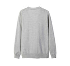 Close-Up of Everanne Diamond Knit Cotton Sweater showing V-Neckline and Button Detail