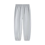 Close-up of the adjustable elastic waistband and flexible ribbed ankles on the Everanne casual unisex joggers.